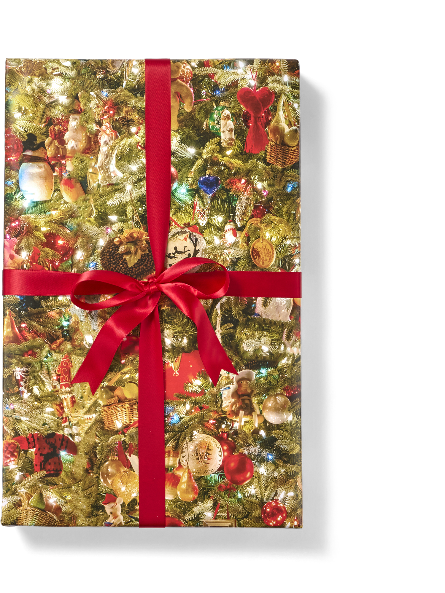 Wrapping paper with a Christmas tree pattern, tied with a red ribbon.