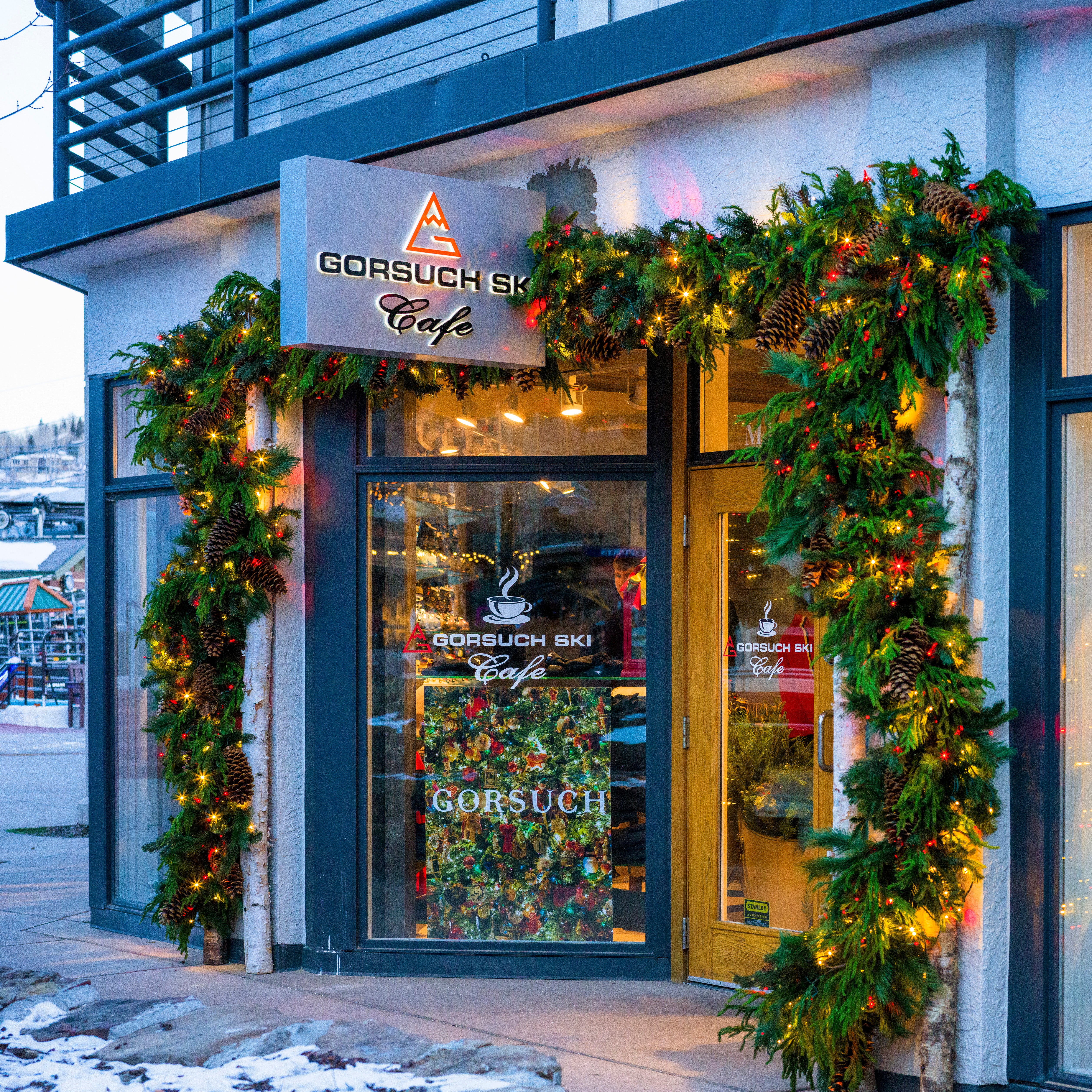 Café exterior with festive decorations and 'Gorsuch' branding.