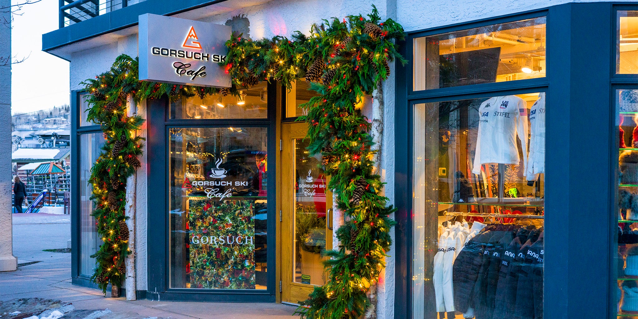 Café exterior with festive decorations and 'Gorsuch' branding.