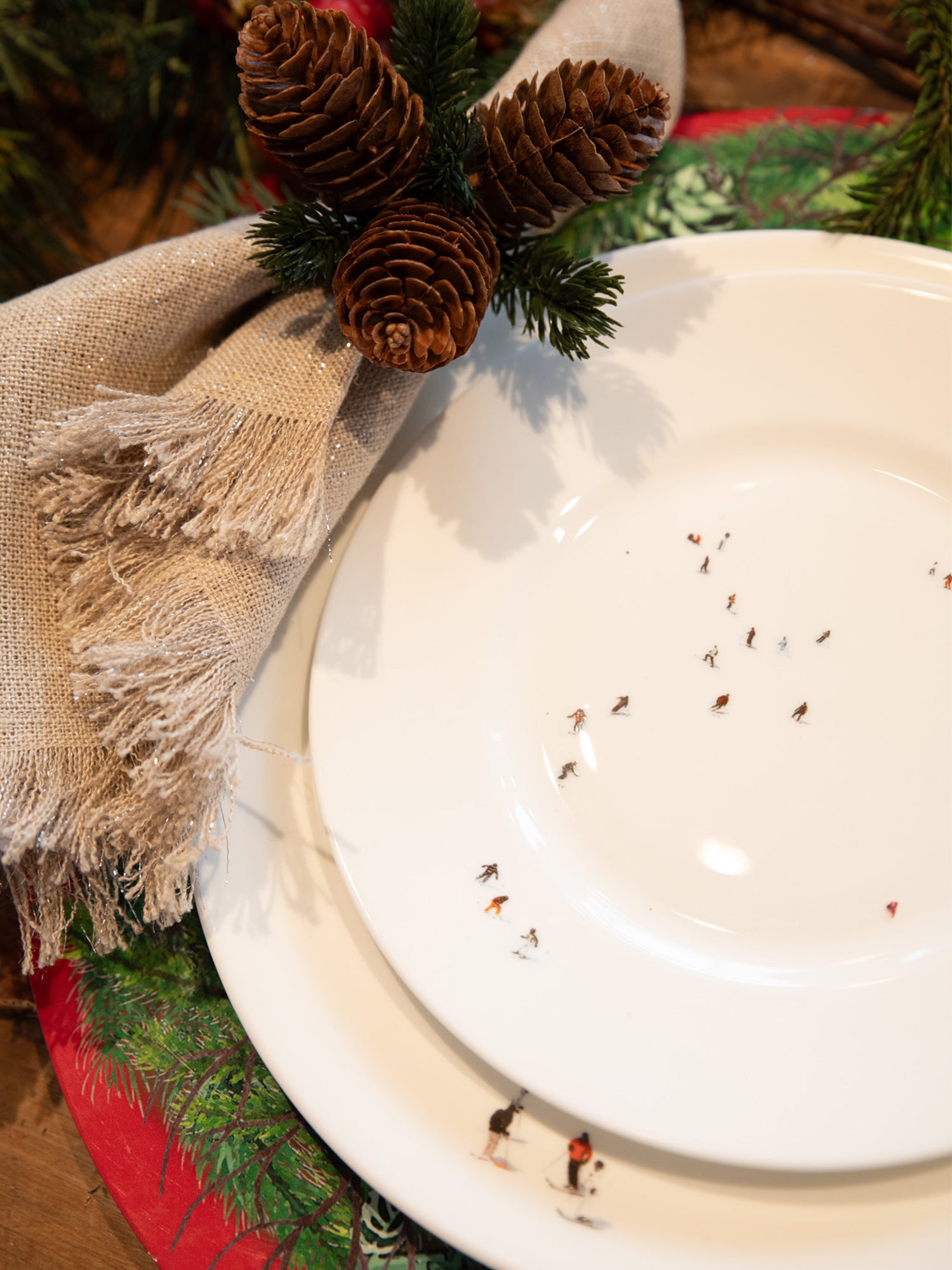 White ceramic plate with decorative elements on a wooden surface