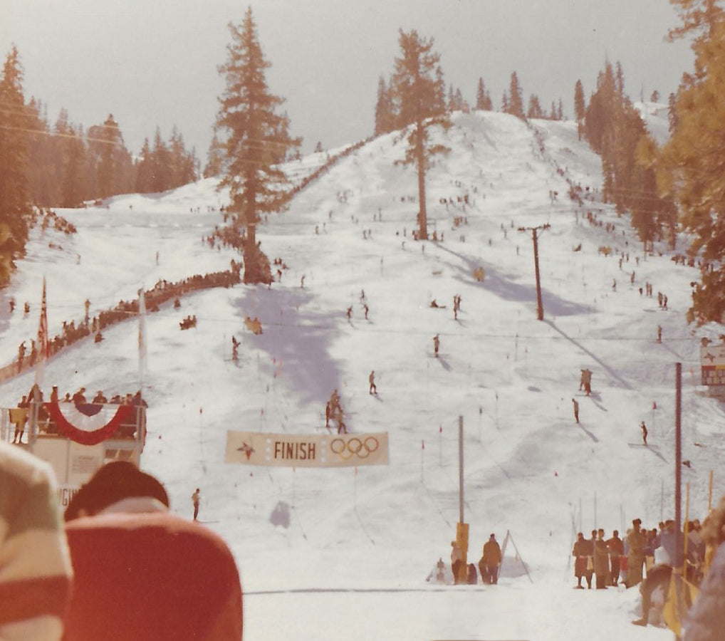 Bottom of the ski race course at the Squaw Valley Olympics with mountain in background.